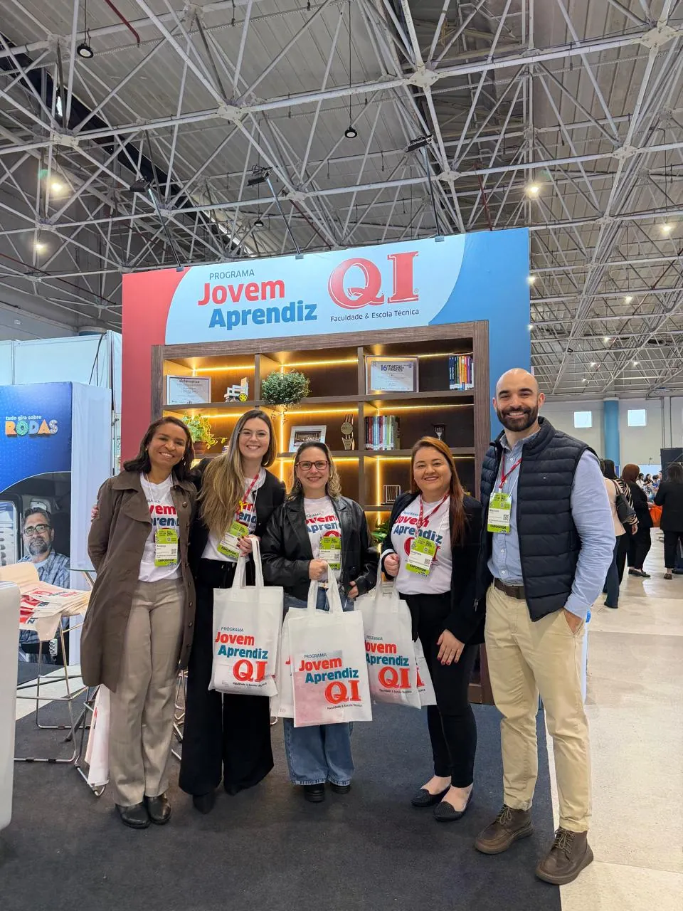 Equipe da QI no estande do CONGREGARH 2026